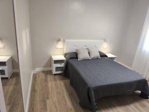a bedroom with a large bed with two night stands at Casa Juanito Rute in Rute +27 photos