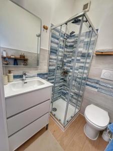a bathroom with a shower and a sink and a toilet at HOME PERLa in San Bartolomeo al Mare +13 photos