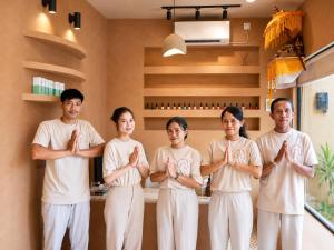 a group of people doing yoga in a room at Villa Nico - Private Pool with Onsite Spa in Canggu +24 photos