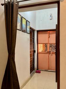 an open door to a room with a window at Raahee Homestay in Varanasi