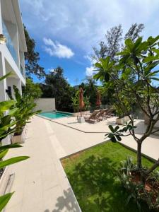 a courtyard with a swimming pool in a house at Hidden Bay Chaloklam in Chaloklum