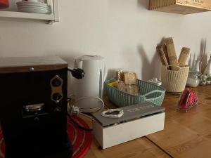 a kitchen counter with a counter top with a food processor and a box at Casa Rossa in Ferentillo