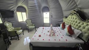 a bedroom with a large bed in a tent at Golden Ridge Sigiriya in Dambulla +9 photos