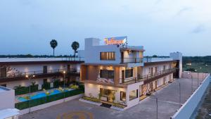 an aerial view of a hotel with a swimming pool at La Antaraa in Arumuganeri