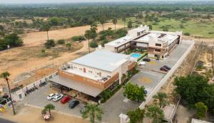 an overhead view of a building with a parking lot at La Antaraa in Arumuganeri +83 photos