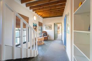 a hallway of a house with a stairway at Peace Valley Guesthouse in Napier