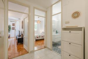 a hallway with a room with a bed and a mirror at Mila in Herceg-Novi +17 photos