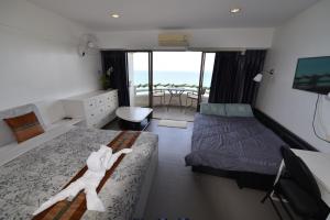 a bedroom with a bed with a stuffed animal on it at VIP CONDO RAYONG 343 in Rayong +38 photos