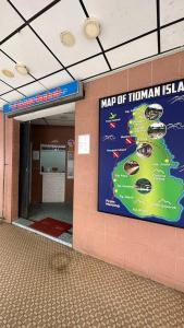 a map of tunnan island on the wall of a building at planet hotel mersing in Mersing