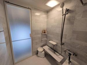 a bathroom with a shower stall with a toilet at HotelG7 in Tokyo +47 photos