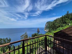 a view of the ocean from a balcony at Stay something in Ch'ŏnbu-ri