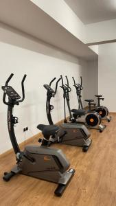 a row of exercise bikes lined up in a room at Pool View - H&A Signature Klebang in Malacca
