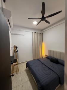 a bedroom with a bed and a ceiling fan at Pool View - H&A Signature Klebang in Malacca +12 photos