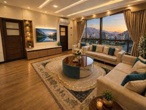 a living room with a couch and a table at Royal Delegation Suite in Kabul
