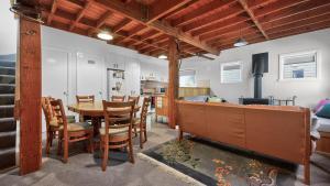 a kitchen and dining room with a table and chairs at Feathertop in Dinner Plain +13 photos