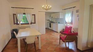 a kitchen and dining room with a table and chairs at LUCIA s sweet Home in Padova