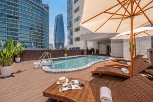 a pool on the rooftop of a building at Petro Hotel Da Nang in Danang