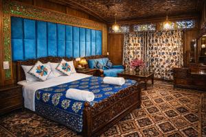 a bedroom with a bed and a couch at Heritage Amina Group Of Houseboats in Srinagar