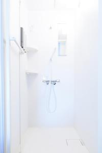 a shower in a bathroom with a glass door at Bears Building in Kumamoto +15 photos