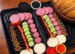 a tray of food with different types of vegetables at Bazarstore Montin Hotel in Baku