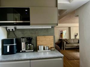 a kitchen with a coffee maker on a counter at Badklippan in Stockholm