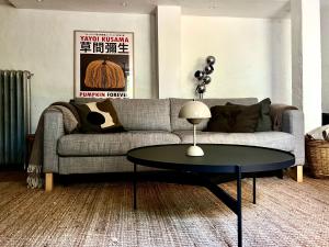 a living room with a couch and a table at Badklippan in Stockholm