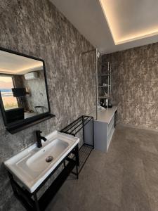 a bathroom with a sink and a mirror at montevela glamping kintamani in Kubupenlokan +72 photos