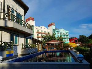 a swimming pool in front of a building at Buan Badatgaeui Chuoek Pension in Buan
