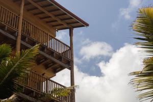 a wooden building with the sky in the background at Coast 67 Boutique Hotel in Ahangama