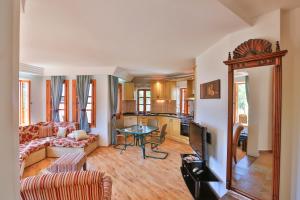 a living room with a couch and a table at Çınarlar Apart KC Blok in Kaş