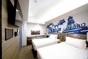 a hotel room with two beds and a tv at KOKO HOTEL Sapporo Susukino 2ⁿᵈ in Sapporo +63 photos