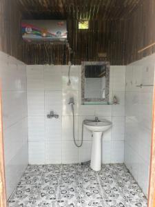 a bathroom with a sink and a mirror at May Lai Homestay in Tả Van