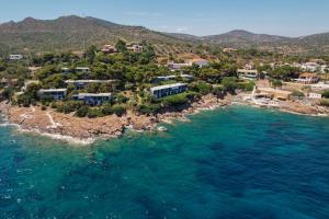 an aerial view of a small island in the ocean at Neptune Suite Sounio in Sounio