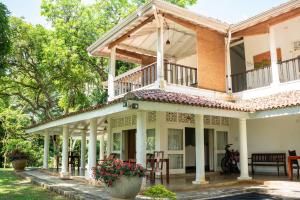 an image of a house with a balcony at Villa Labugolla in Kandy