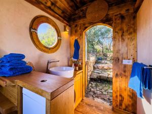 a bathroom with a sink and a mirror at Bioloco - sea, nature, pool in Castiadas +37 photos