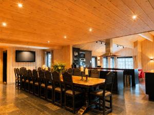 a large dining room with a table and chairs at Spacious cabin in Hemsedal, 8 bedrooms and sauna in Hemsedal