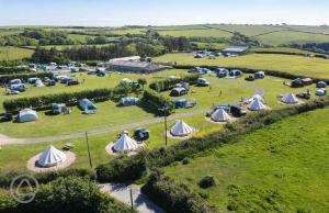 an aerial view of a group of tents in a field at The Ship Aground Woolacombe in Woolacombe