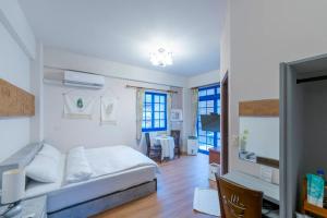 a bedroom with a bed and a living room at Star Coffee & Homestay in Nanzhuang