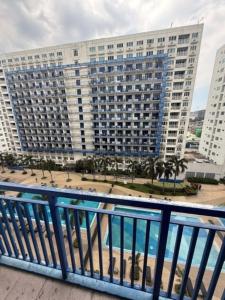 a view from the balcony of a large building at Sea Residences Sunset Point in Manila