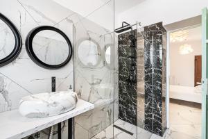 a bathroom with a shower and a mirror at Hotel Cazino Nord in Mamaia +48 photos