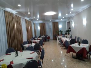 a banquet hall with tables and chairs at Hotel Ristorante Lilia in Verona