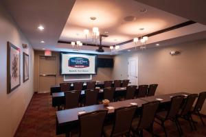 a conference room with a long table and chairs at TownePlace Suites by Marriott Roswell in Roswell +44 photos