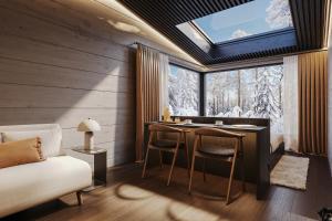 a room with a table and chairs and a window at ALVA Resort in Rovaniemi