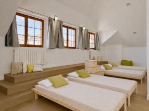 a room with four beds in a room with windows at Villa Las tres Mares 6826 in Noja +32 photos
