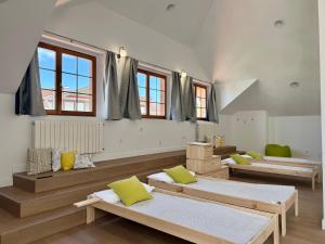 a room with three beds in it with windows at Villa Las tres Mares 6826 in Noja