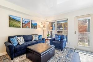 a living room with a couch and two chairs at Fall Line 107 in Telluride