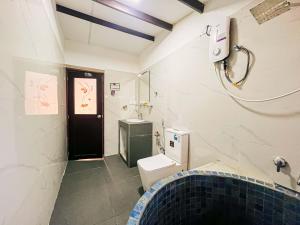 a bathroom with a toilet and a sink at Mahagedara Villa Wilpattu in Nochchiyagama +22 photos