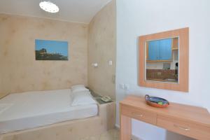 Postel nebo postele na pokoji v ubytování Windmill Villas