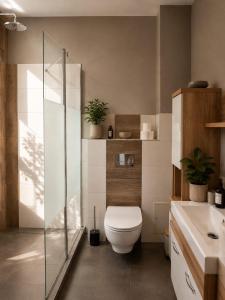 a bathroom with a toilet and a sink at Apartamenty Sunny Bear in Jelenia Góra +34 photos