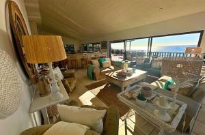 a living room with a view of the ocean at Kangela 1 in Ponta Malangane